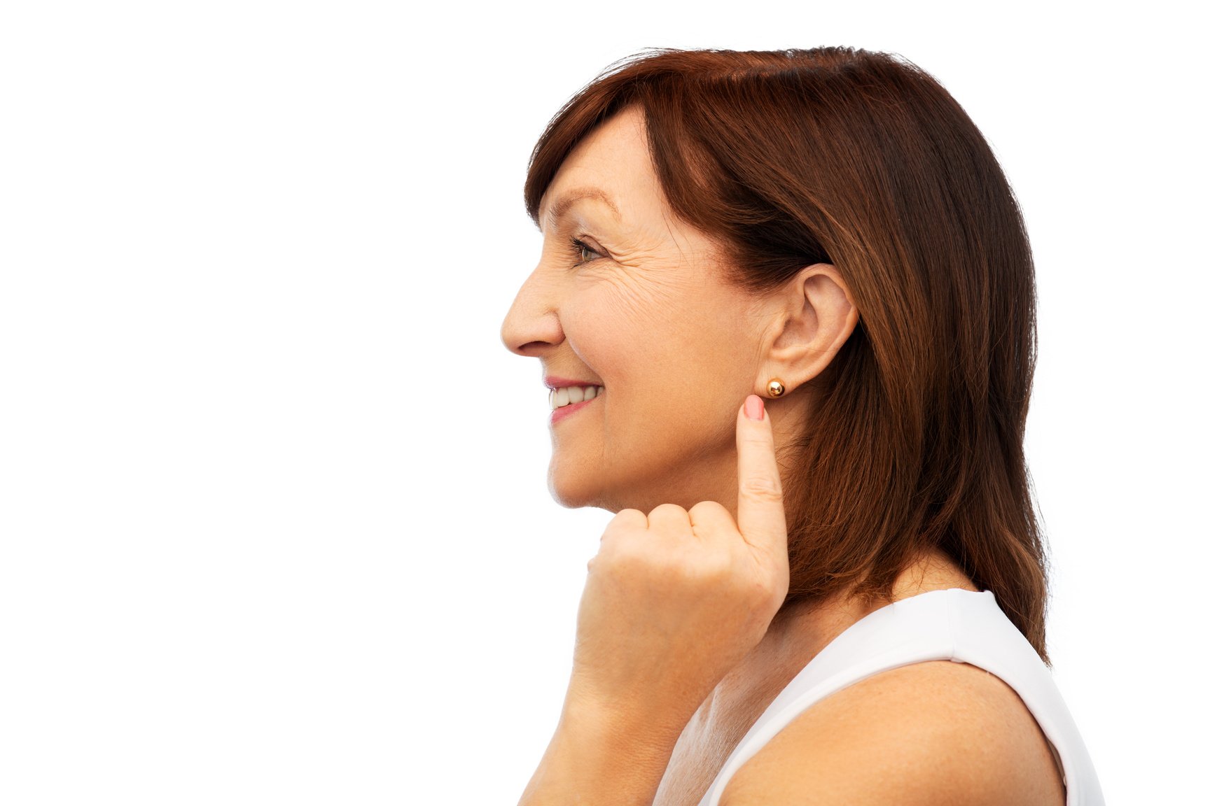 Smiling Senior Woman Pointing to Her Earring
